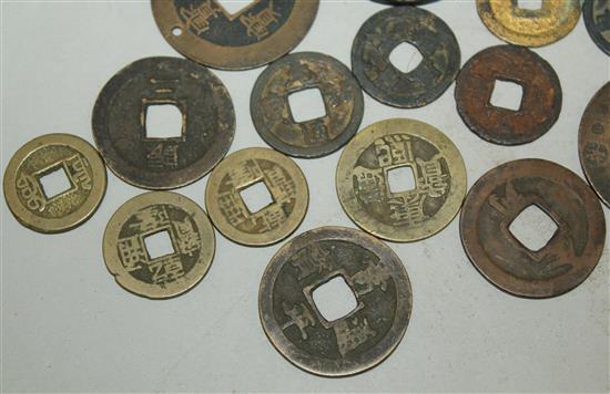 A collection of Japanese mon and half-shu coins and Chinese bronze and copper coins, 15th-19th century (23)